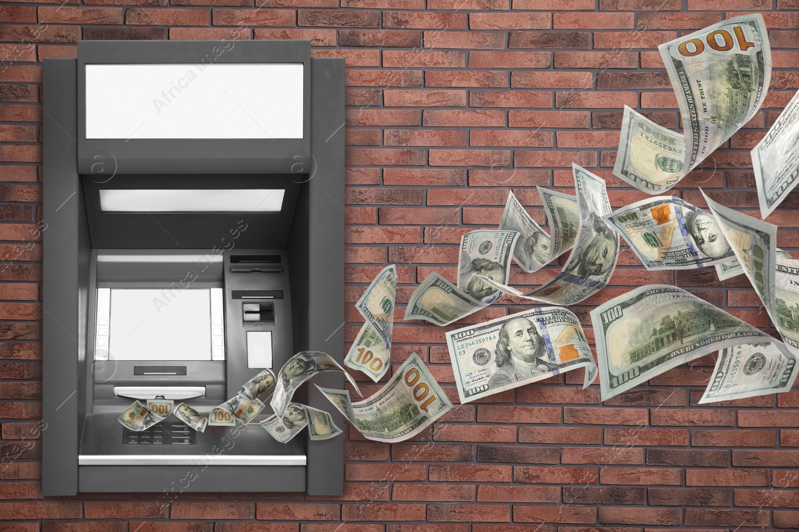 Image of Modern automated cash machine on brick wall and flying money