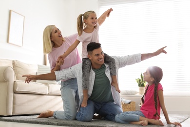 Photo of Happy family spending time together at home