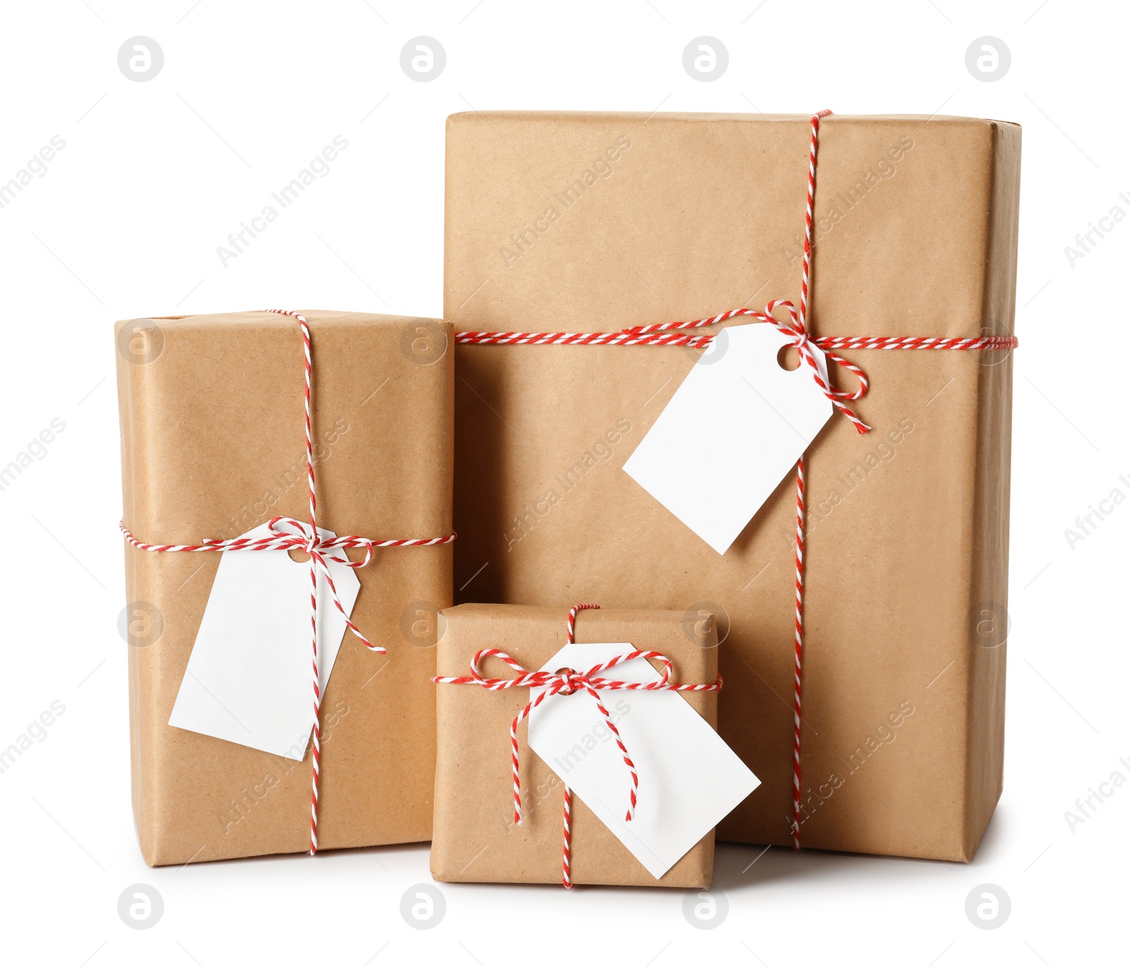 Photo of Gift boxes wrapped in kraft paper with tags on white background