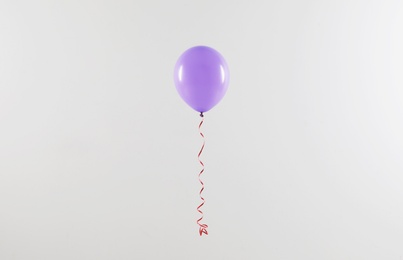 Bright balloon on light background. Celebration time