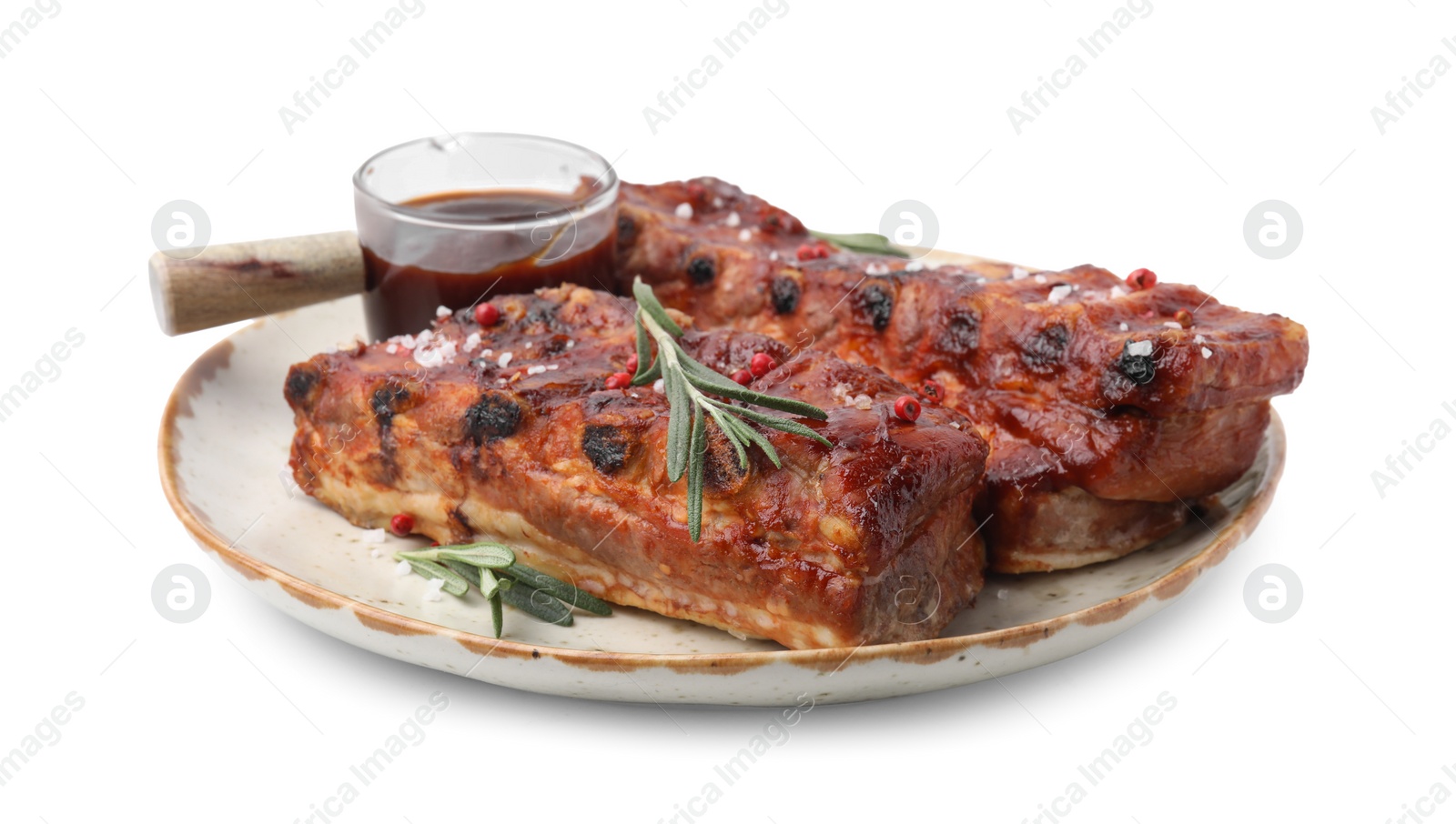 Photo of Tasty roasted pork ribs, sauce and rosemary isolated on white