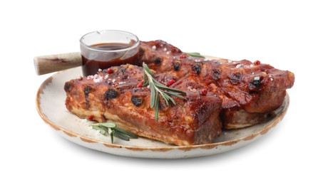 Photo of Tasty roasted pork ribs, sauce and rosemary isolated on white