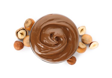 Photo of Tasty chocolate hazelnut spread and nuts on white background, top view