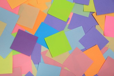 Photo of Many colorful stickers as background, top view
