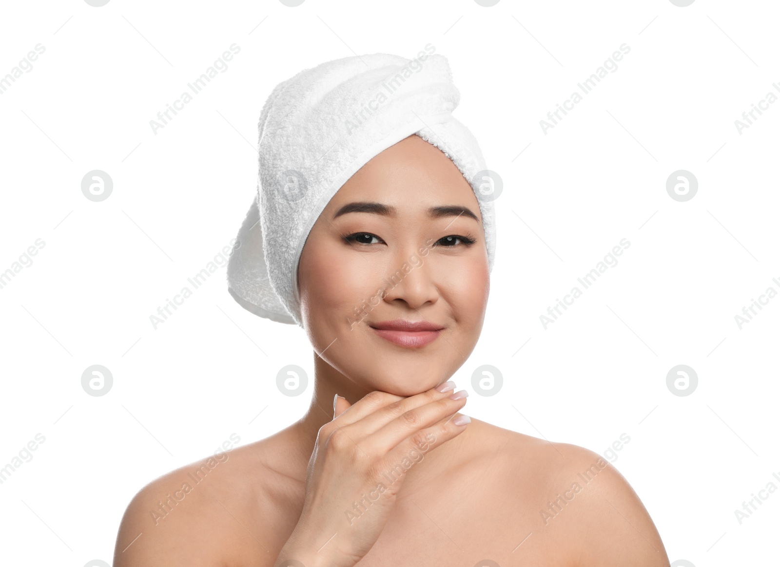 Photo of Portrait of beautiful Asian woman with towel on head against white background. Spa treatment