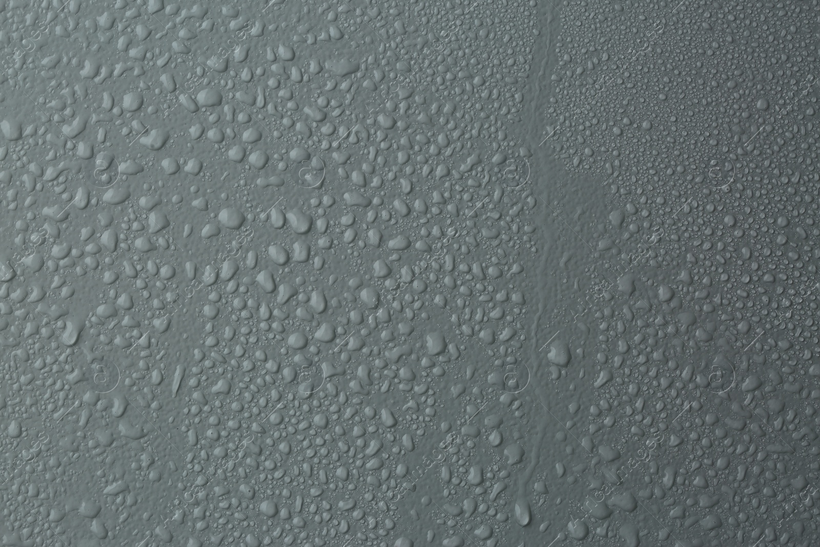 Photo of Many water drops on light grey background