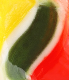 Tasty colorful fruit flavored candy as background, closeup