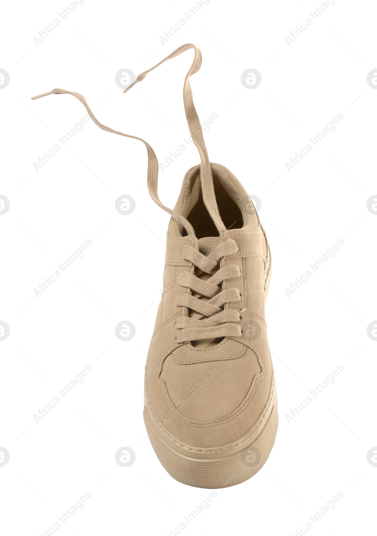 Photo of One stylish beige sneaker isolated on white