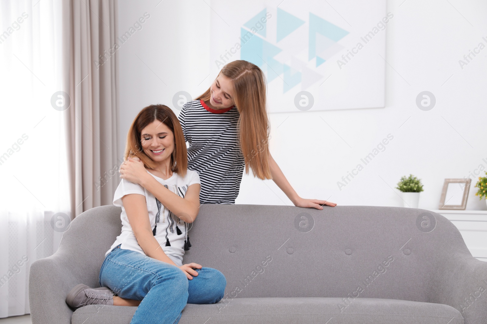 Photo of Teenager girl comforting her mother at home