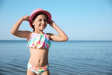 Cute little child on sunny day. Beach holiday