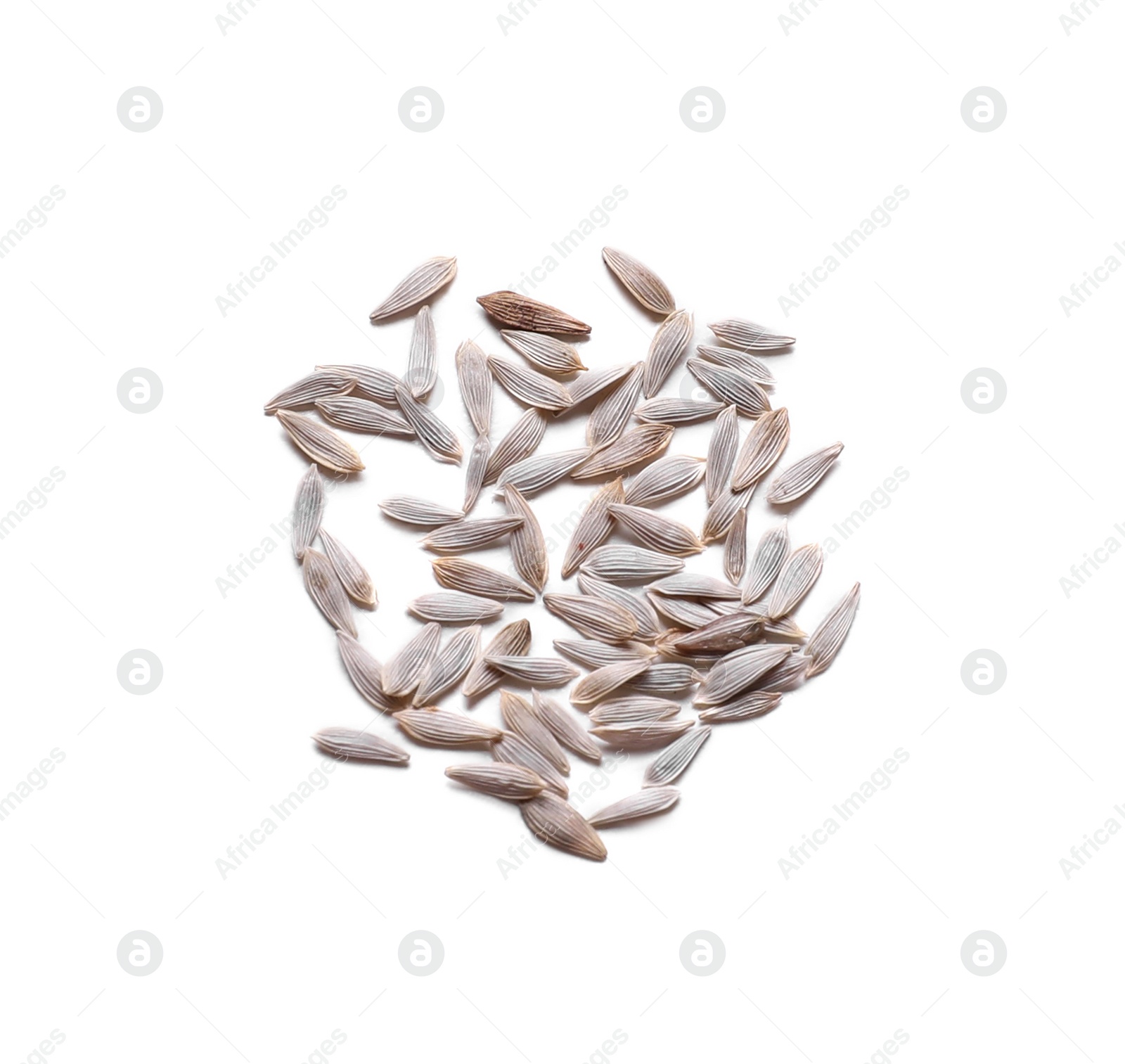 Photo of Pile of lettuce seeds on white background, top view