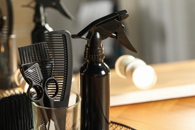 Photo of Set of hairdresser tools in salon, closeup. Space for text