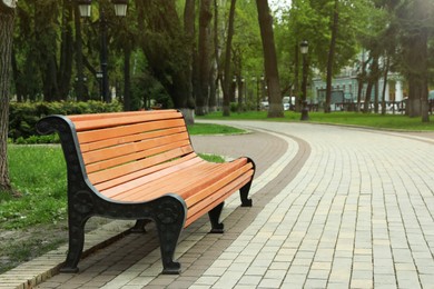Photo of Beautiful view of city park with bench on spring day