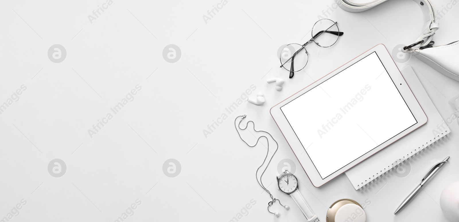 Photo of Flat lay composition with modern tablet on white background. Space for text