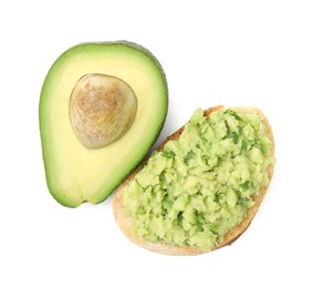 Photo of Delicious sandwich with guacamole and half of avocado on white background, top view