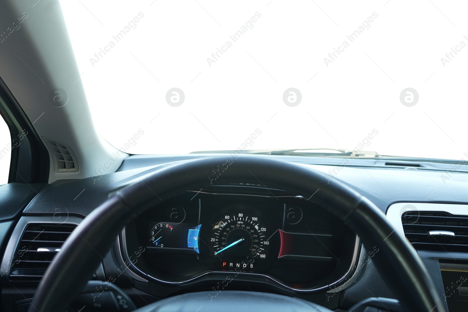 Photo of Speedometer on dashboard and steering wheel inside car