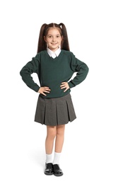 Photo of Little girl in stylish school uniform on white background