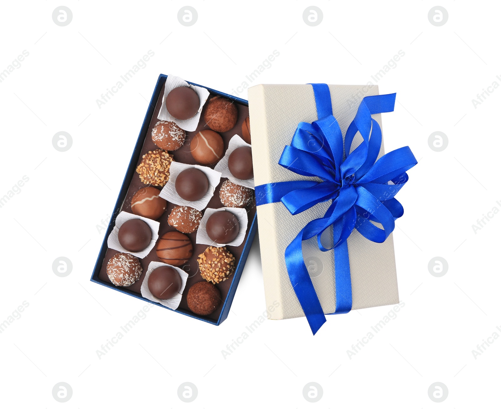 Photo of Box with delicious chocolate candies isolated on white, top view