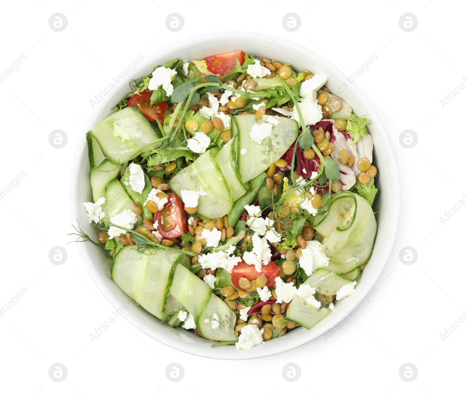 Photo of Bowl of delicious salad with lentils, vegetables and feta cheese isolated on white, top view