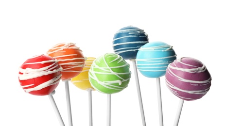 Photo of Set of delicious colorful cake pops on white background