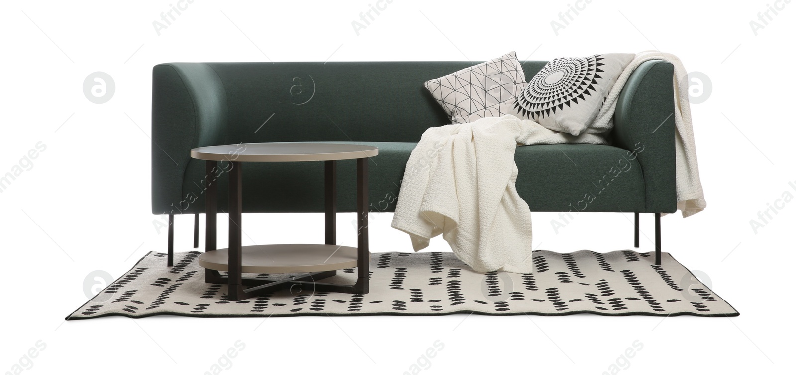 Photo of Comfortable green sofa with cushions, blanket and table on white background. Furniture for living room interior