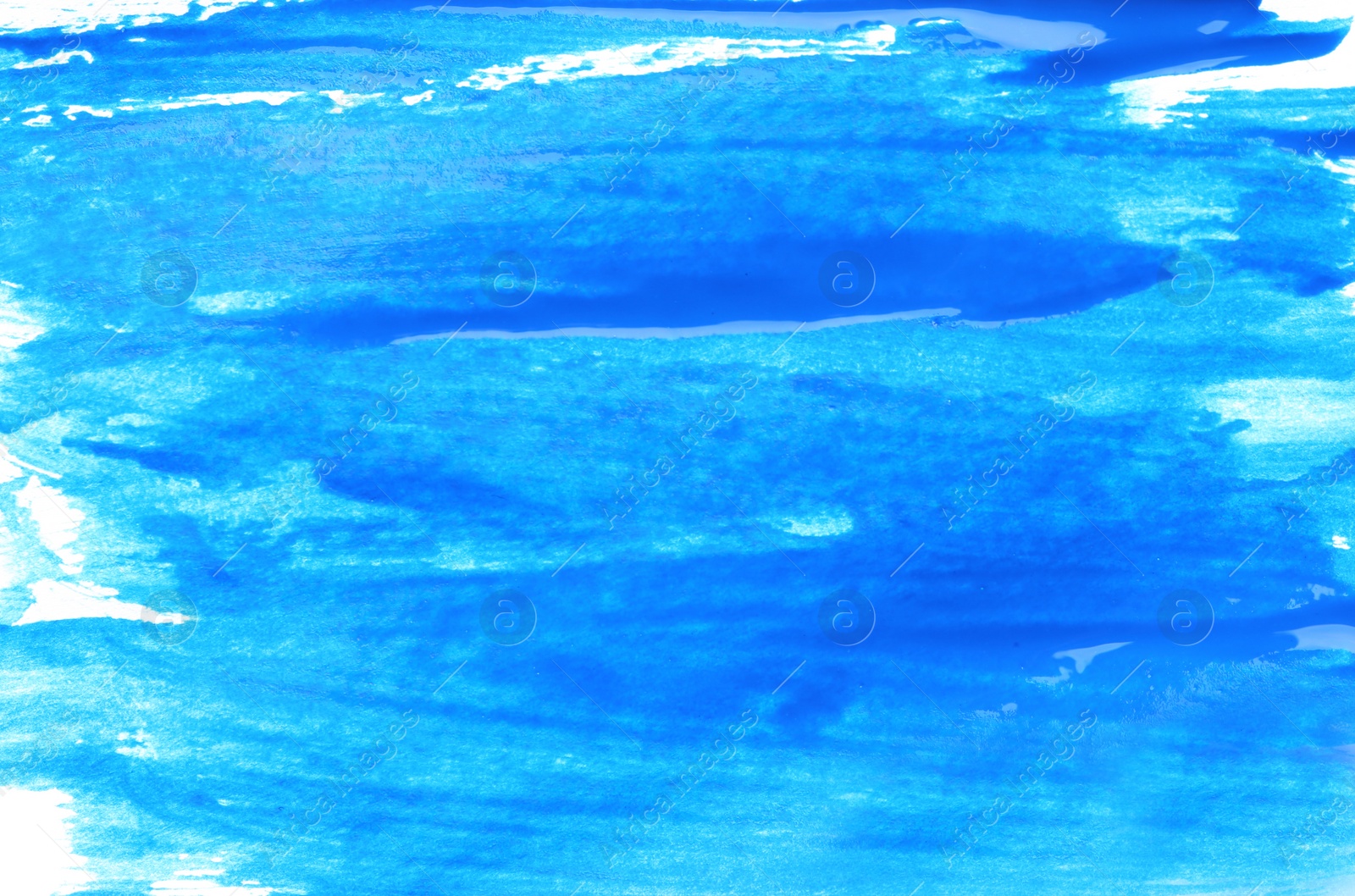 Photo of Abstract brushstrokes of blue paint as background