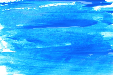 Photo of Abstract brushstrokes of blue paint as background