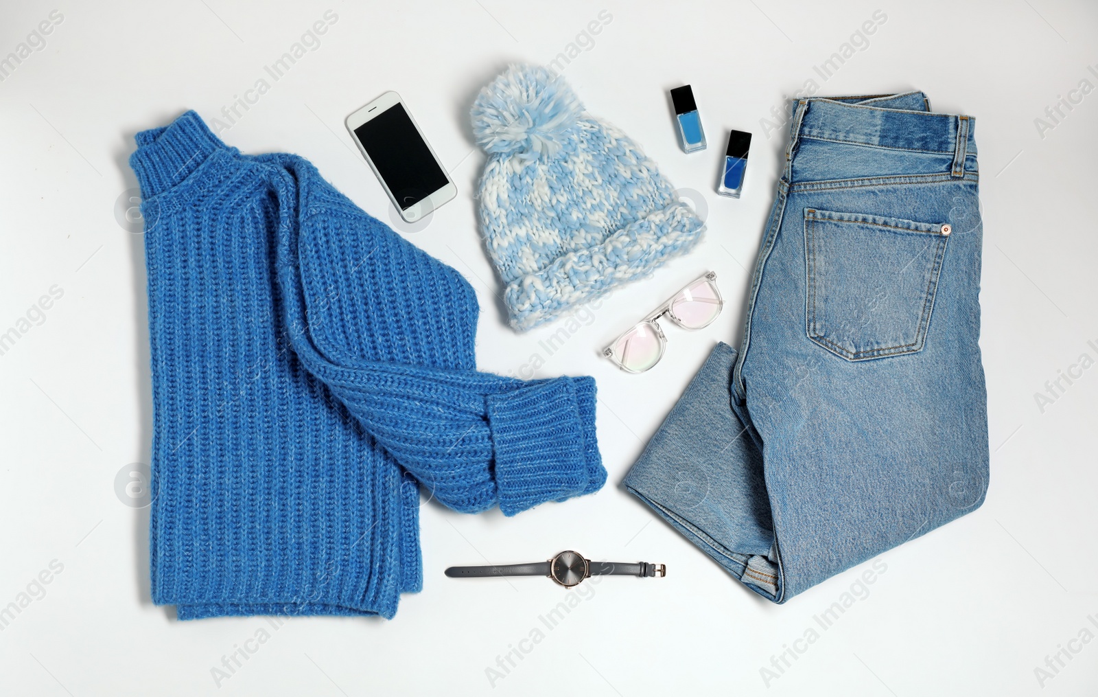 Photo of Flat lay composition with female winter clothes on white background