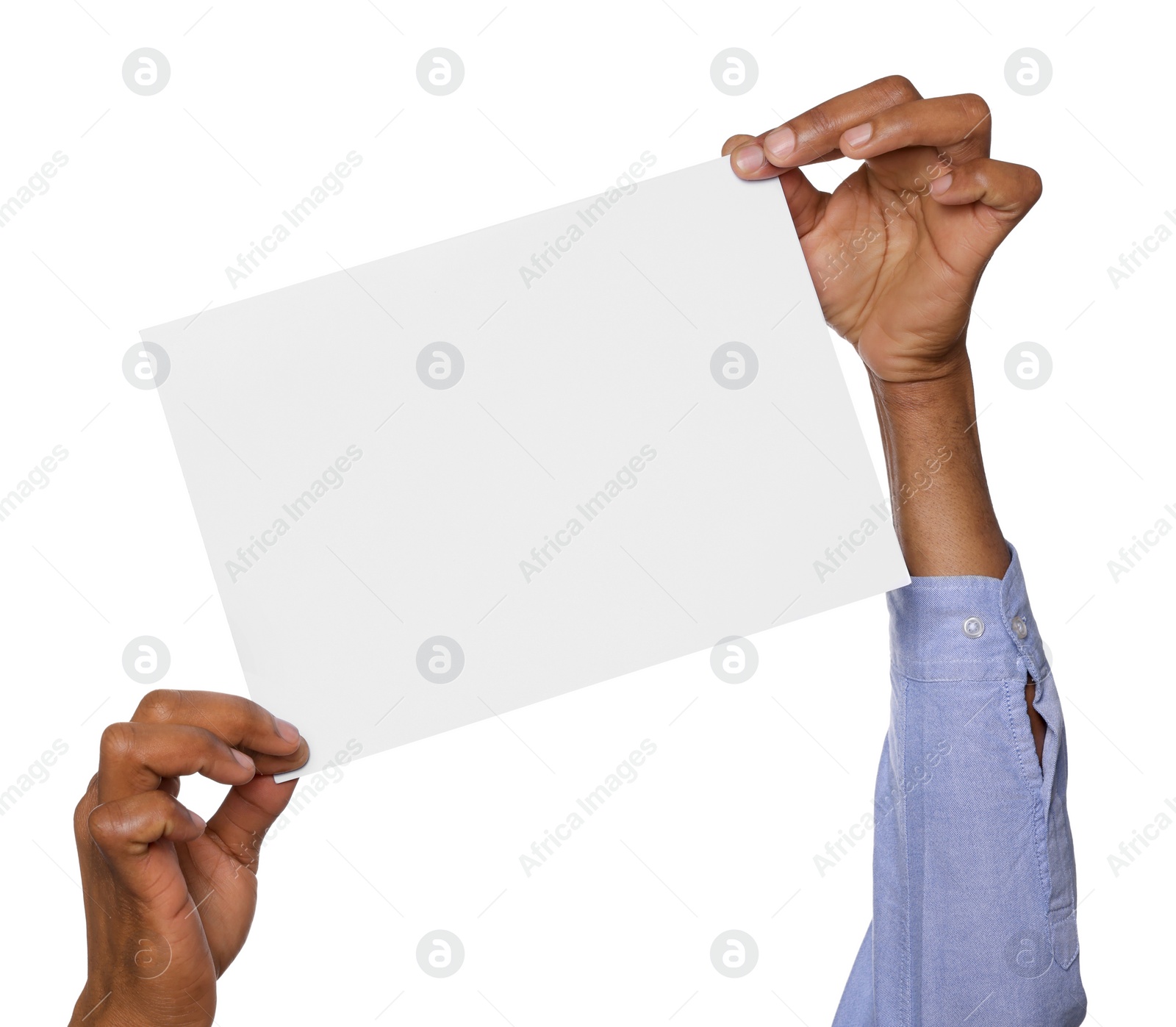 Photo of African American man holding sheet of paper on white background, closeup. Mockup for design