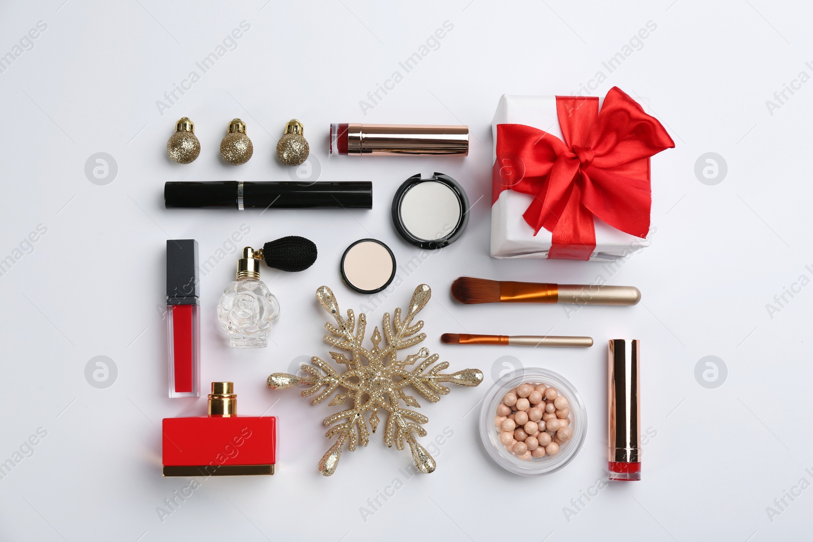 Photo of Flat lay composition with decorative cosmetic products on light background. Winter care