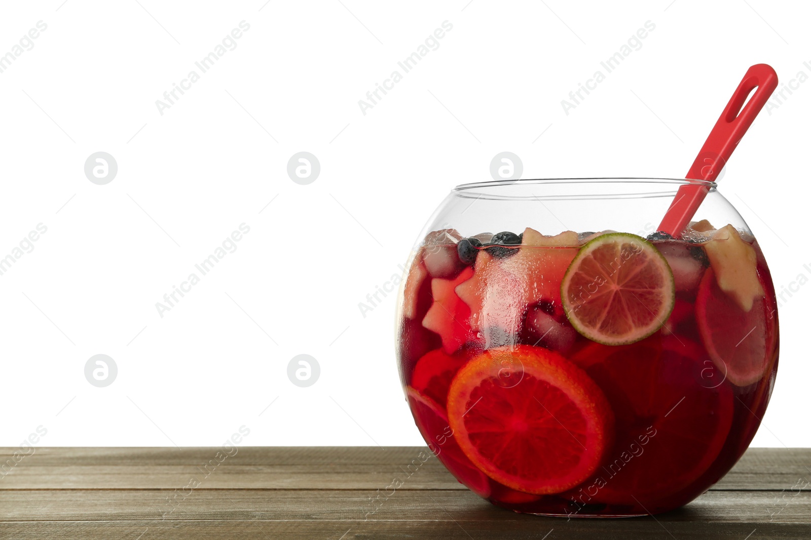 Photo of Glass bowl of Red Sangria and ladle on wooden table against white background. Space for text