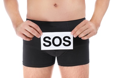 Photo of Man holding SOS sign on white background, closeup. Urology problems