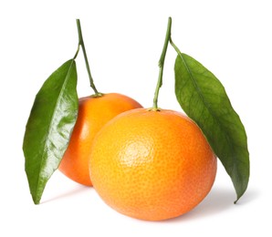 Photo of Fresh ripe juicy tangerines with green leaves isolated on white