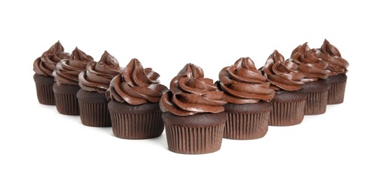 Photo of Delicious chocolate cupcakes with cream on white background