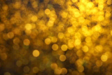 Photo of Blurred view of golden lights as background. Bokeh effect