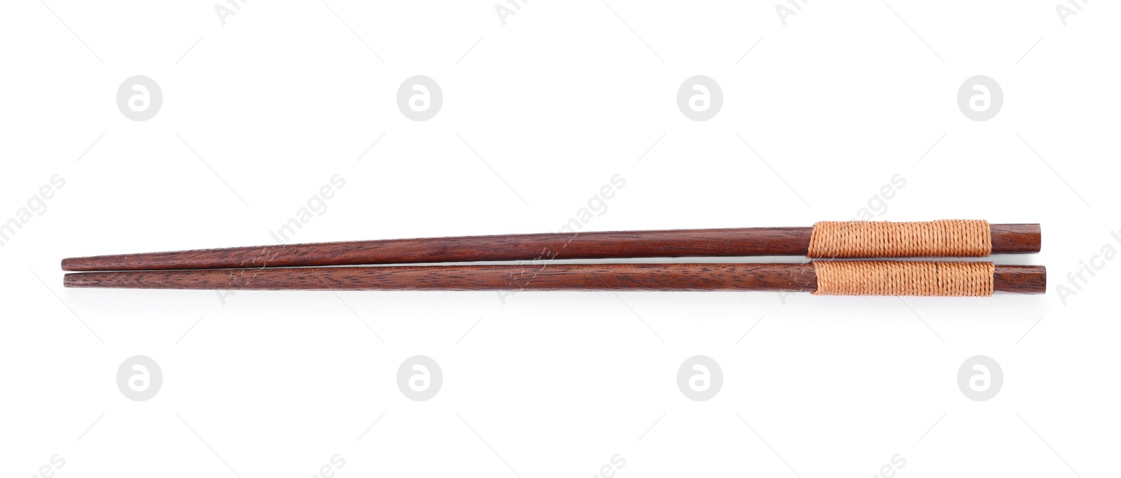Photo of Pair of wooden chopsticks isolated on white, top view
