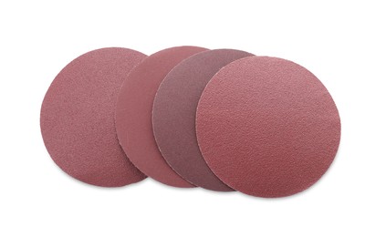 Photo of Many coarse sandpaper disks isolated on white, top view