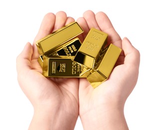 Woman holding gold bars on white background, closeup