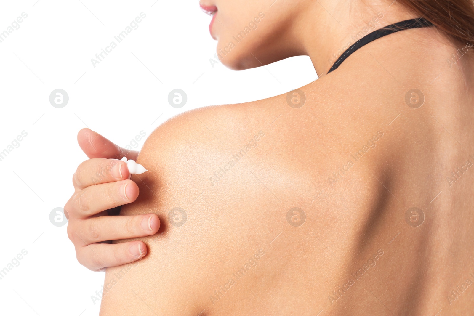 Photo of Woman applying sun protection body cream on white background, closeup