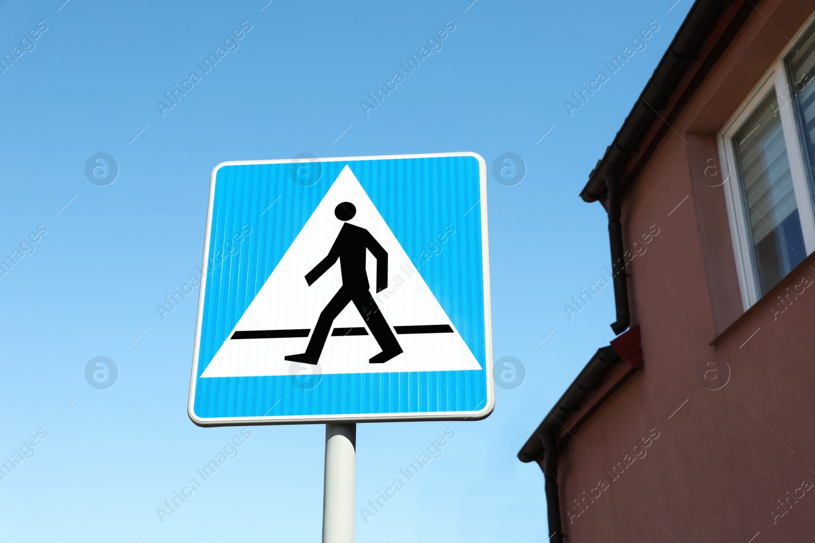 Photo of Traffic sign Pedestrian Crossing on city street