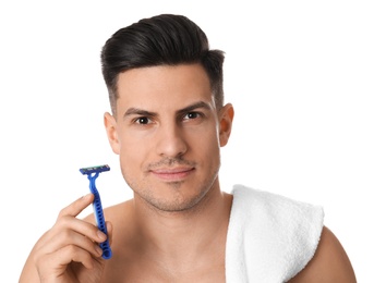 Photo of Handsome man with razor before shaving on white background