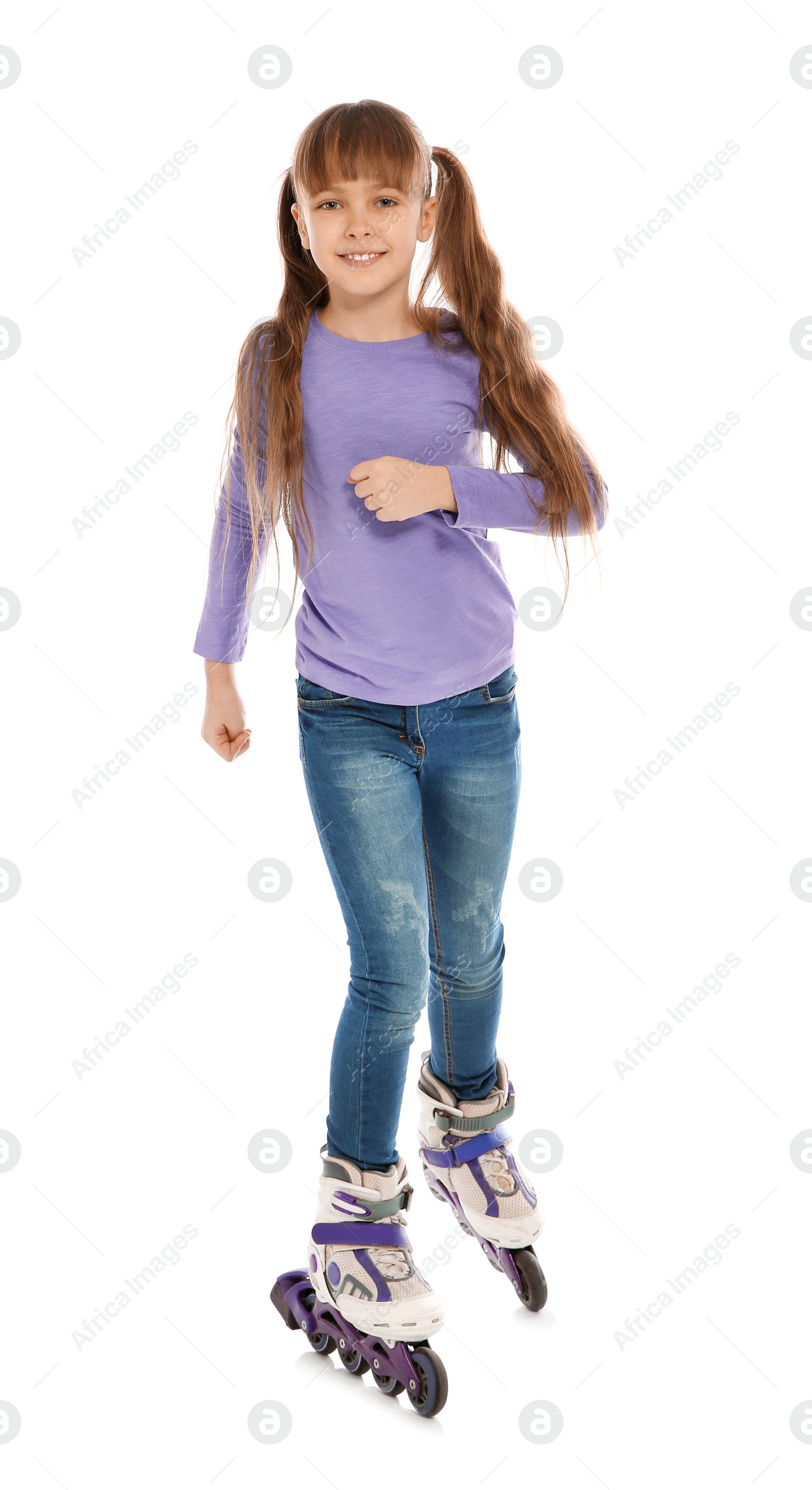 Photo of Little girl with inline roller skates on white background