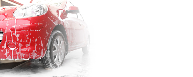 Image of Red auto with foam at car wash, space for text. Banner design