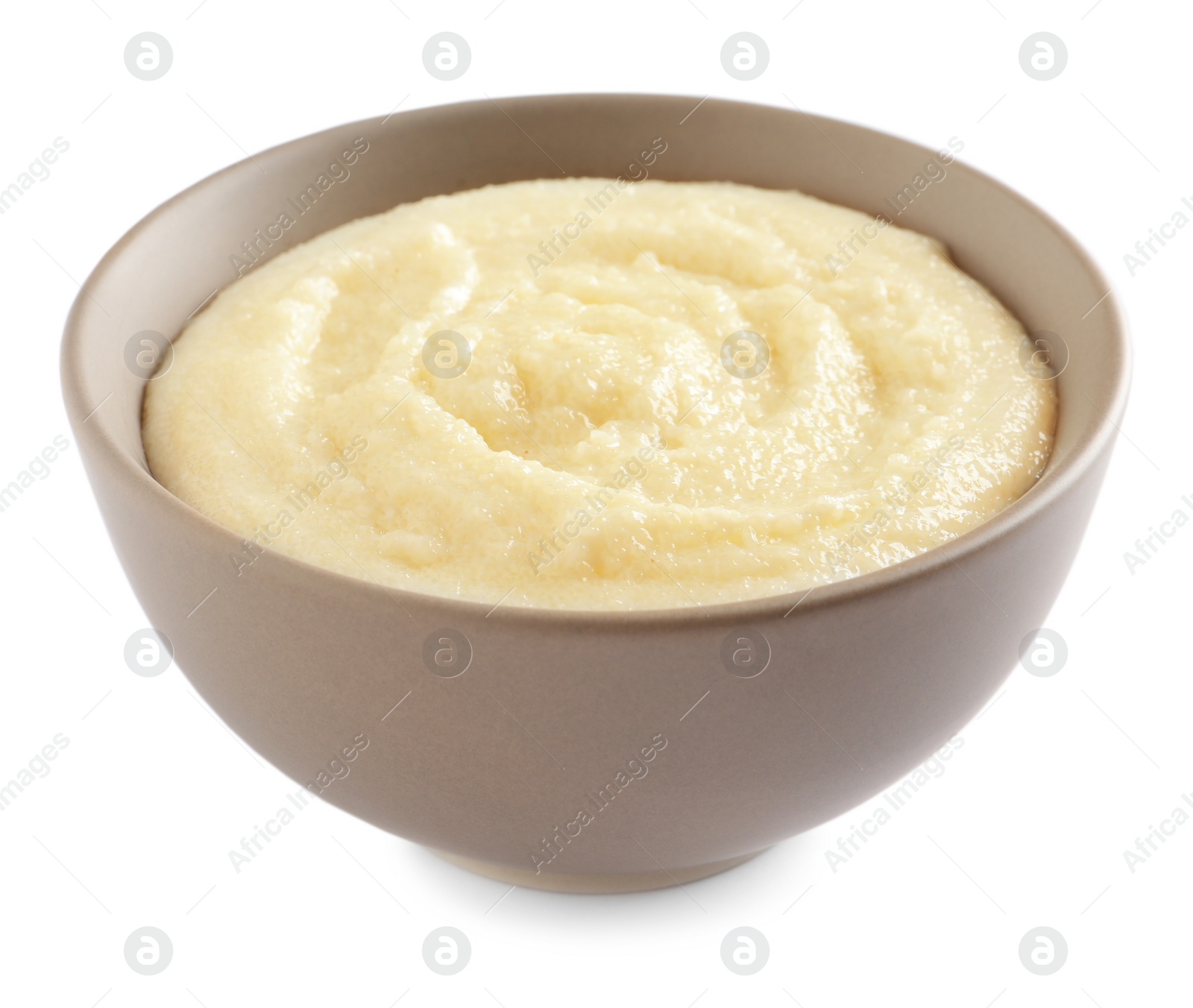 Photo of Bowl with delicious semolina pudding on white background