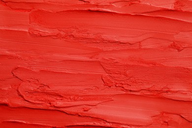 Texture of bright lipstick as background, top view