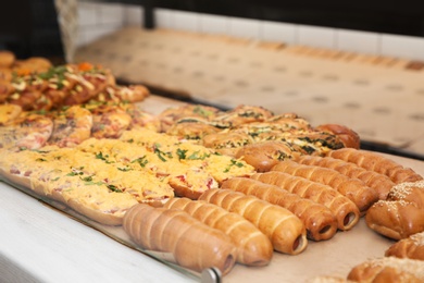 Photo of Fresh pastries on counter in bakery store