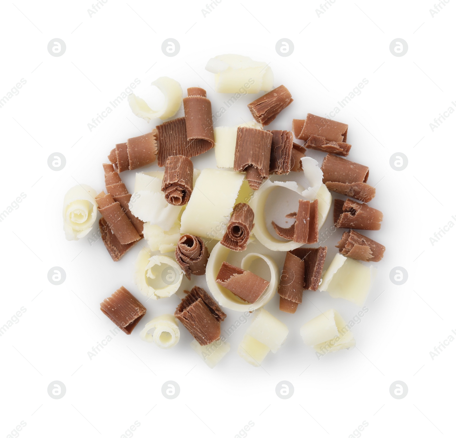 Photo of Pile of different tasty chocolate shavings isolated on white, top view