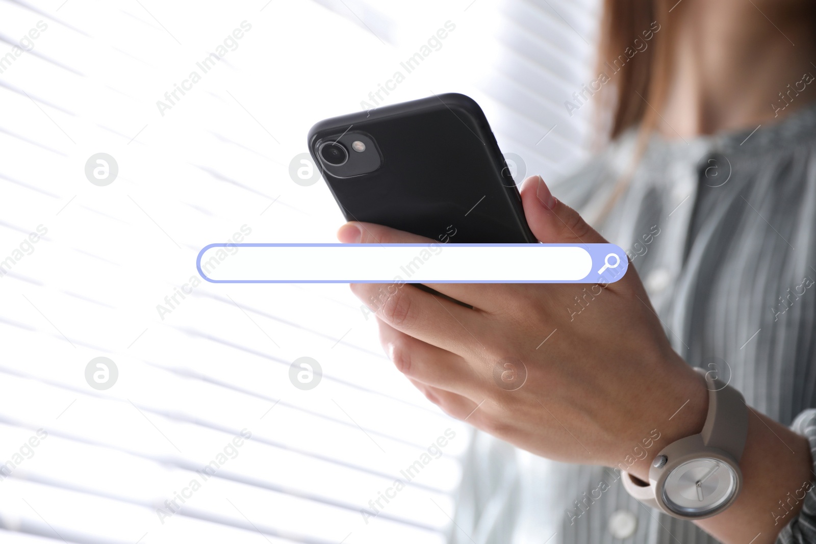 Image of Search bar of website and woman holding smartphone indoors, closeup