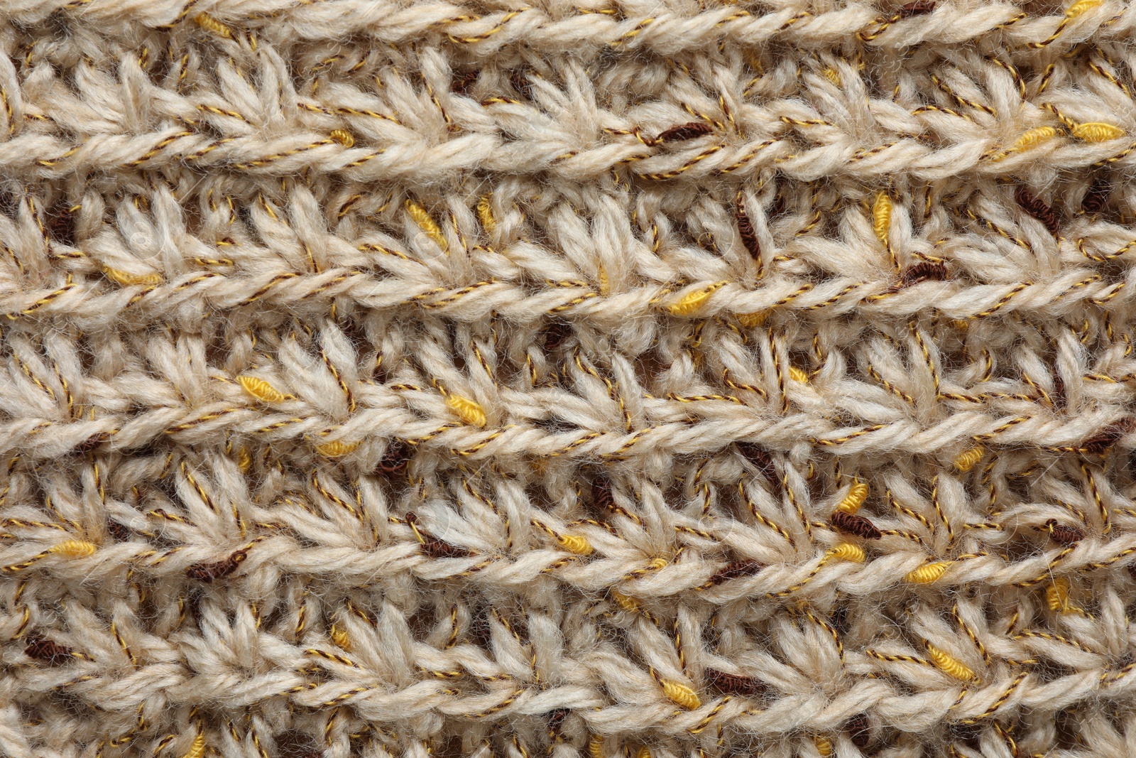 Photo of Texture of knitted fabric as background, top view