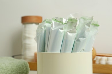 Many tampons in holder, closeup. Menstrual hygienic product